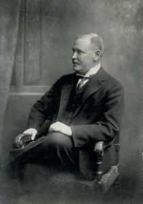 A black and white image of Rothschild sitting down