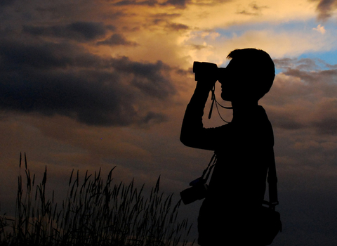 Binoculars at sunset wildlife trust