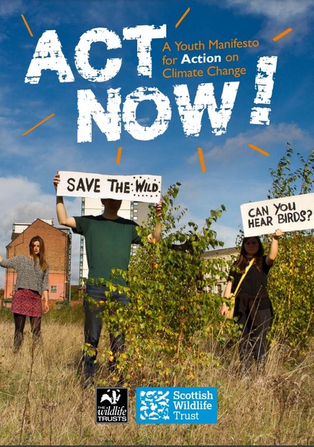 An image of 3 young people stood in an urban garden holding signs which read 'save the wild' and 'can you hear birds?' with the words 'Act Now! A youth manifesto for action on climate change' over the top of the image in white