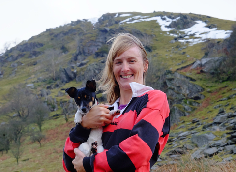 Emma with her dog in the hills