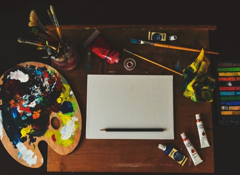 Painting equipment on a wood desk