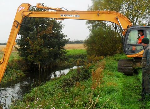 Cutting vegetation to create wildlife habitat in the River Perry