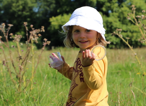 Girl with bug pot